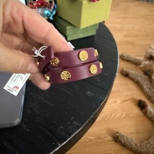 Tory Burch wrap around bracelet deep purple with gold symbol NWT